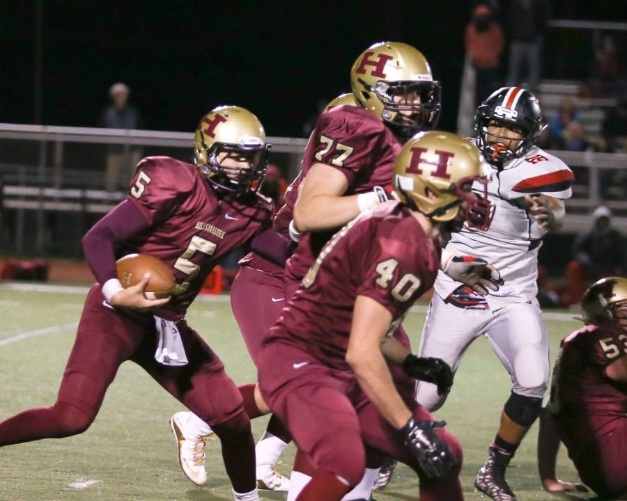 Junior quarterback Joe Schultz carries the ball into Elizabeth territory in the team's 28-21 loss. Schultz is one of several players expected to lead the Raiders next season.