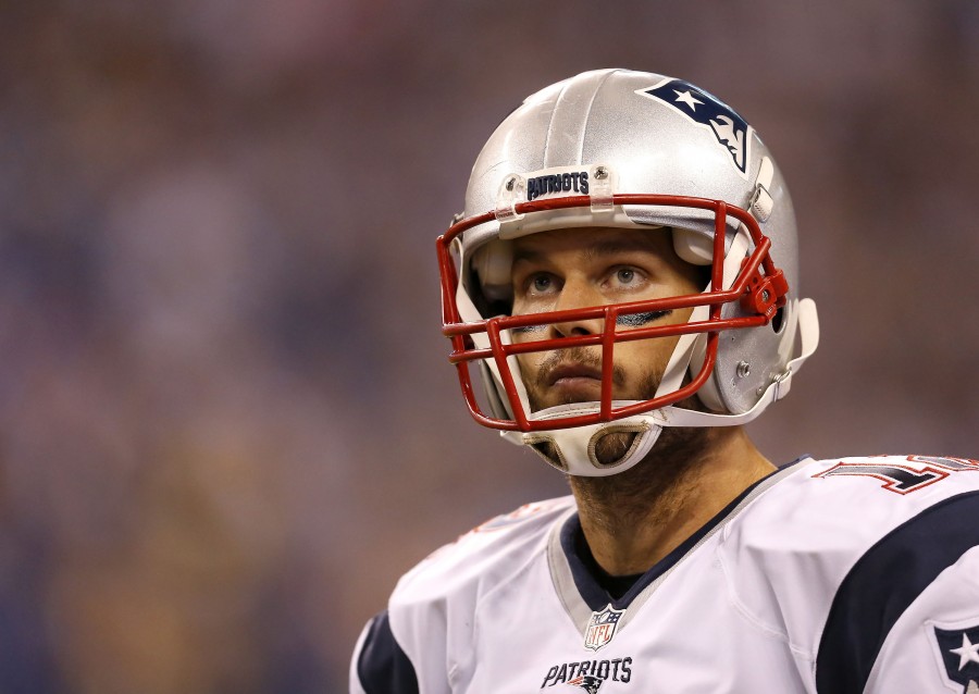 New England Patriots quarterback Tom Brady (12) watches the game against the Indianapolis Colts at Lucas Oil Stadium on Sunday night, Oct. 18, 2015 in Indianapolis. The Patriots won 34-27. 