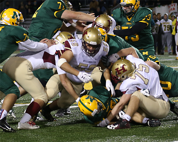 Senior Omar Sultan (59) powers through the Montgomery opposition in the team's 21-14 loss to the Cougars on Oct. 30.