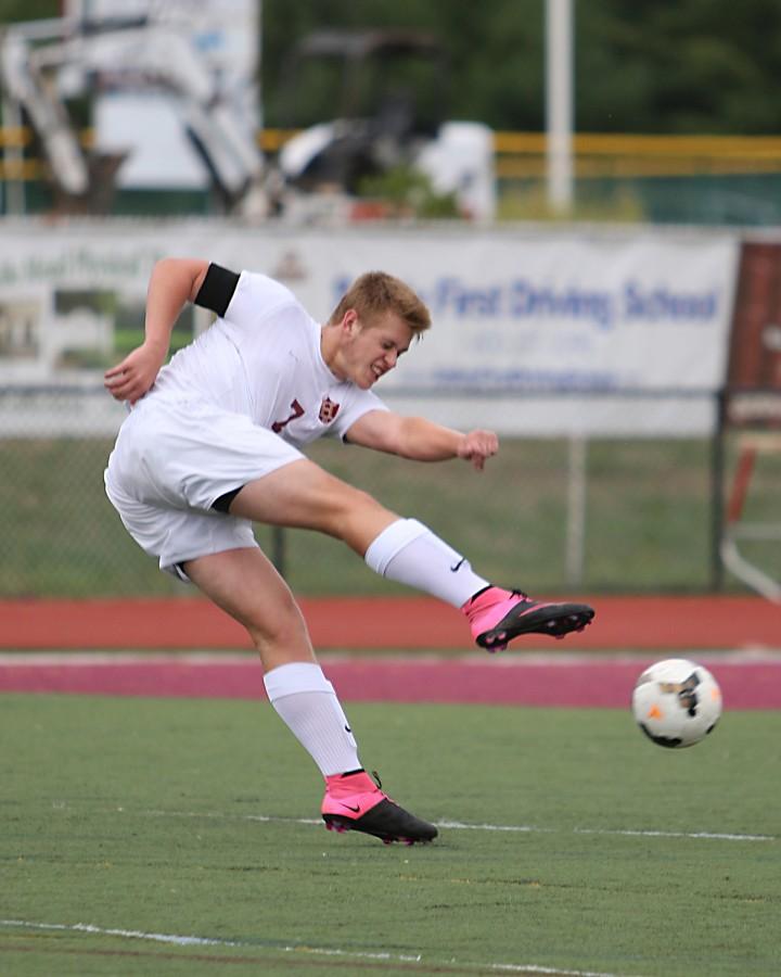 Senior Edward Michta launches a ball into enemy territory.