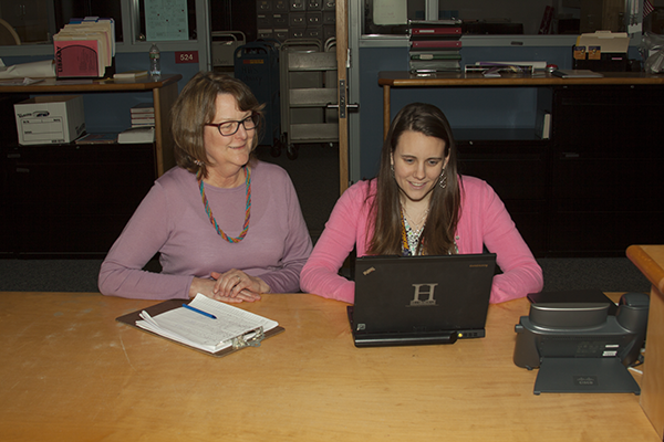 Librarians Connie Swanzer, left, and Lisa Olszewski, right, can actually make research papers enjoyable.