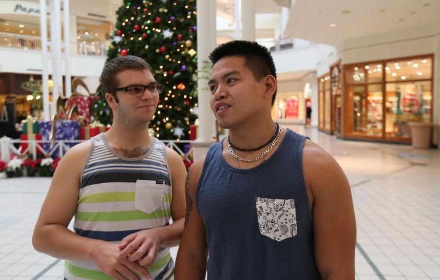 Eric Shard, left, and Efren Devera shop for the holidays at the Sanford Mall in Sanford, Fla., on Tuesday, Dec. 8, 2015. 