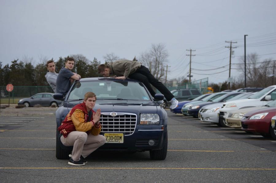 Senior Mike Grabon is proud of his whip and friends Kyle Hurley, Matt DiDomenico, and Cole Norfleet are always ready for a ride in the 300.