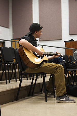 Sophomore Jake Romano jammin' on the guitar in Music Studio.