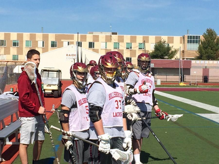 Senior Travis Casey prepares to take the field alongside teammates juniors Matt Gradone (left) and Jeff Alboum. The team opens its season March 30 against Hunterdon Central.