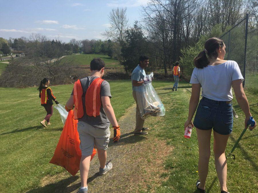 Members of the German Honor Society patrol Raider Boulevard to clean the area of trash.