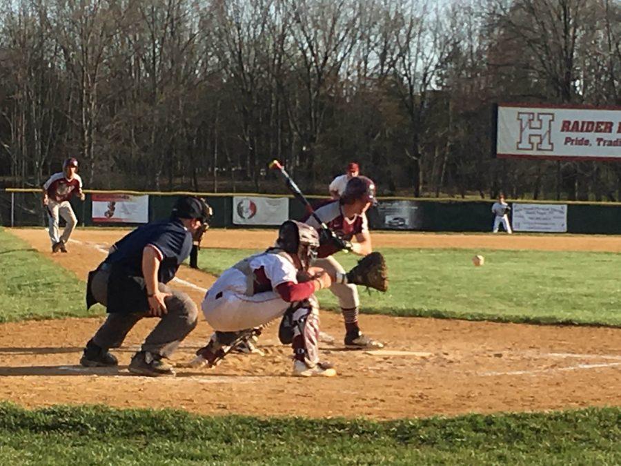 Senior Zach Maggio readies for the incoming fastball hoping that it will strike out the opponent. 