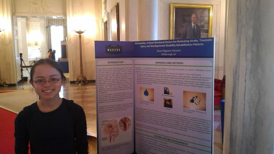 Sophomore Diana Voronin displays her work to a series of well known individuals at the White House  Science Fair in April.