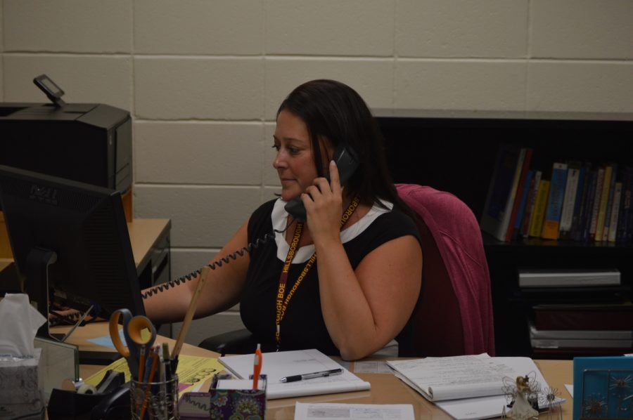 Director of Guidance Jessica Smedley fields a call at her new job.