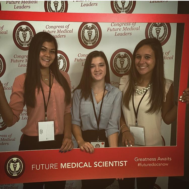 From left to right, juniors Chelsea Chin and Gina Clementi and Sam Levonaitis pose after participating in The National Academy of Future Physicians and Medical Scientists conference.