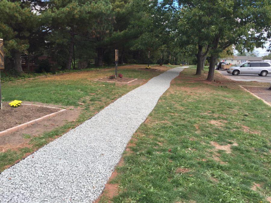 Photo of Anthony Herbert's project, a 500 foot stone pathway outside of Mary Mother of God.