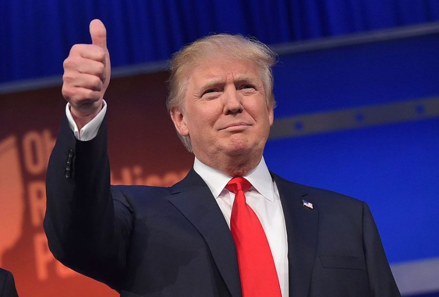 Trump is all thumbs up after winning the presidential election.