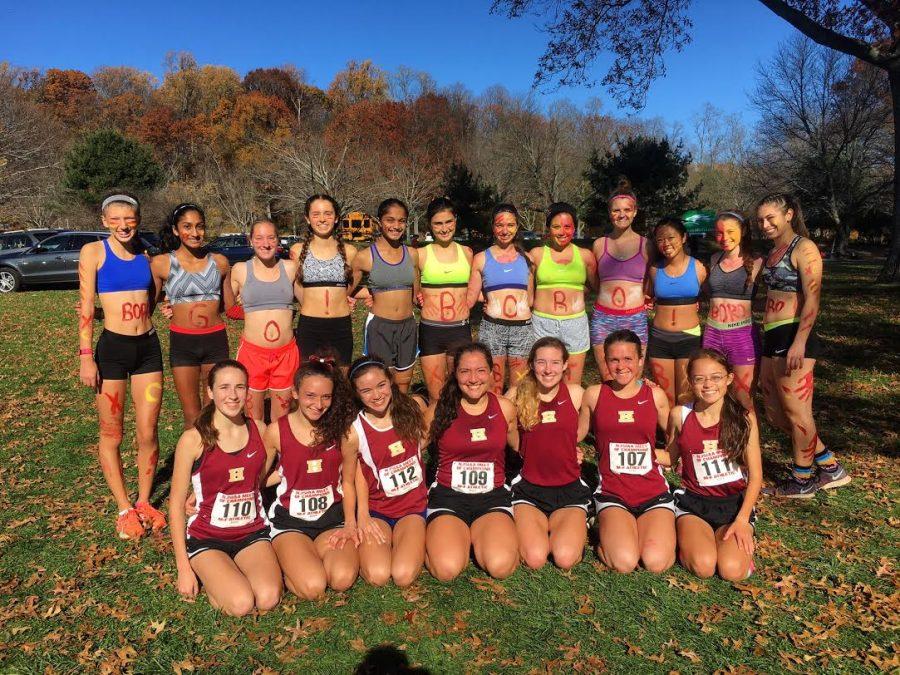 The 2016 girls cross country team poses at the Meet of Champions. The team finished 7th place at the prestigious event.