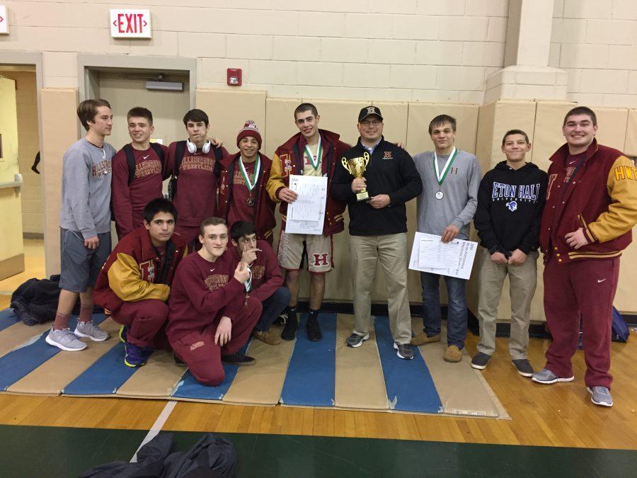 The wrestling team poses with some well-deserved hardware after taking 3rd place at the East Brunswick Bear Invitational.