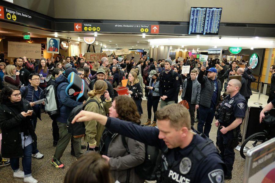 Sea-Tac Airport protest against immigration ban. Sit-in blocking arrival gates until 12 detainees at Sea-Tac are released.