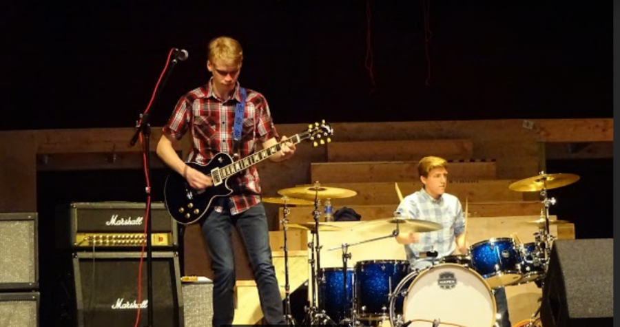 Sophomore Luke Angello shreds on his guitar while freshman Jake Laifer keeps the beat during last week's Battle of the Bands.