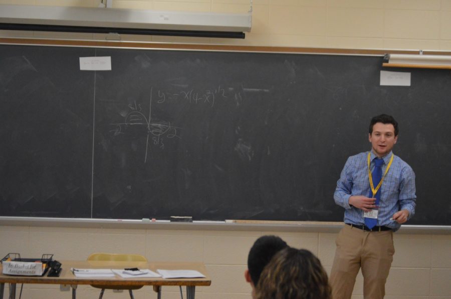 Student teach Joseph Daly leads his students through some graphing magic.