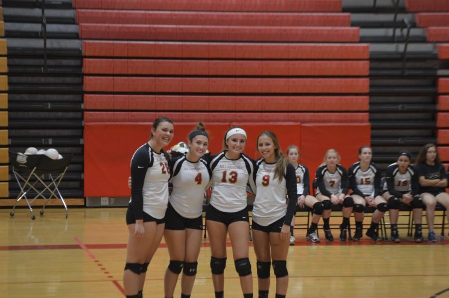 Senior Jillian Boose, juniors Gianna LoCicero and Lenah Chedid, and sophomore Morgan Krempasky quickly pose for a picutre during their senior night game. 