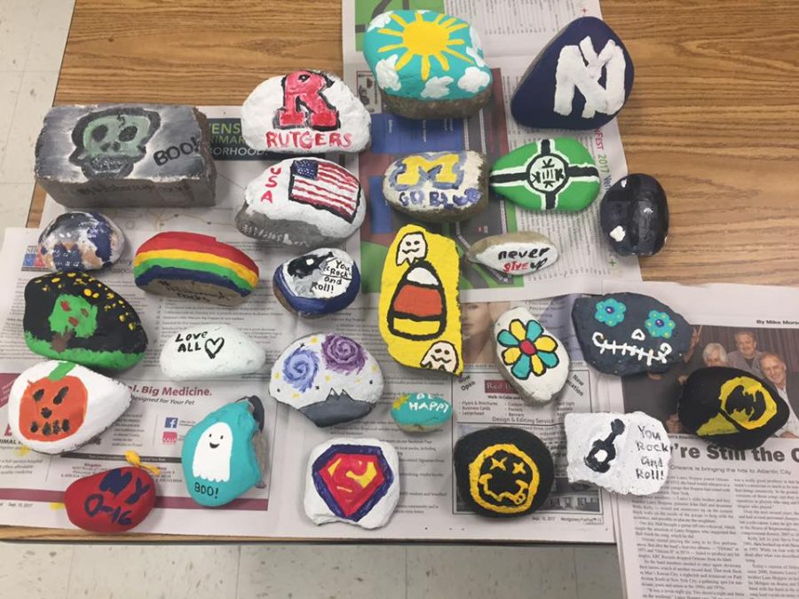 Students in Caryn Brogan's Government and Politics class painted rocks to participate in the community program.