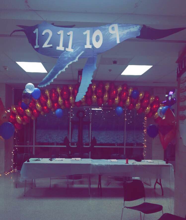 Attendees were welcomed by a spirited balloon arch and an ocean themed entrance.