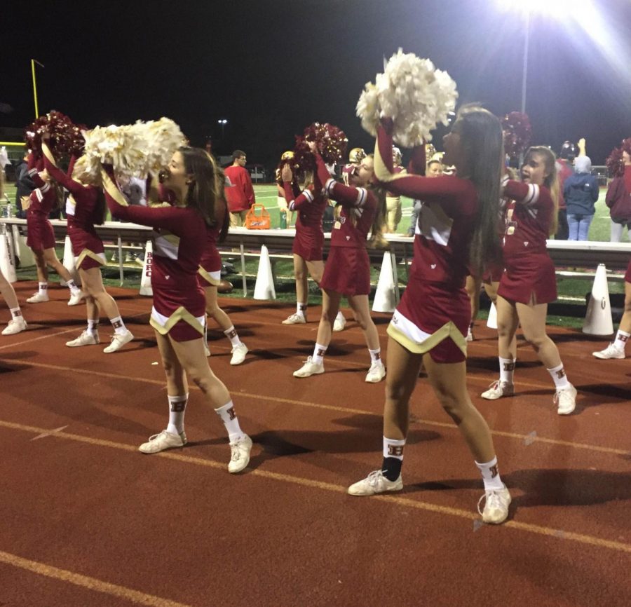 Seniors Gina Clementi and Chelsea Chin lead the underclassmen during a cheer. 