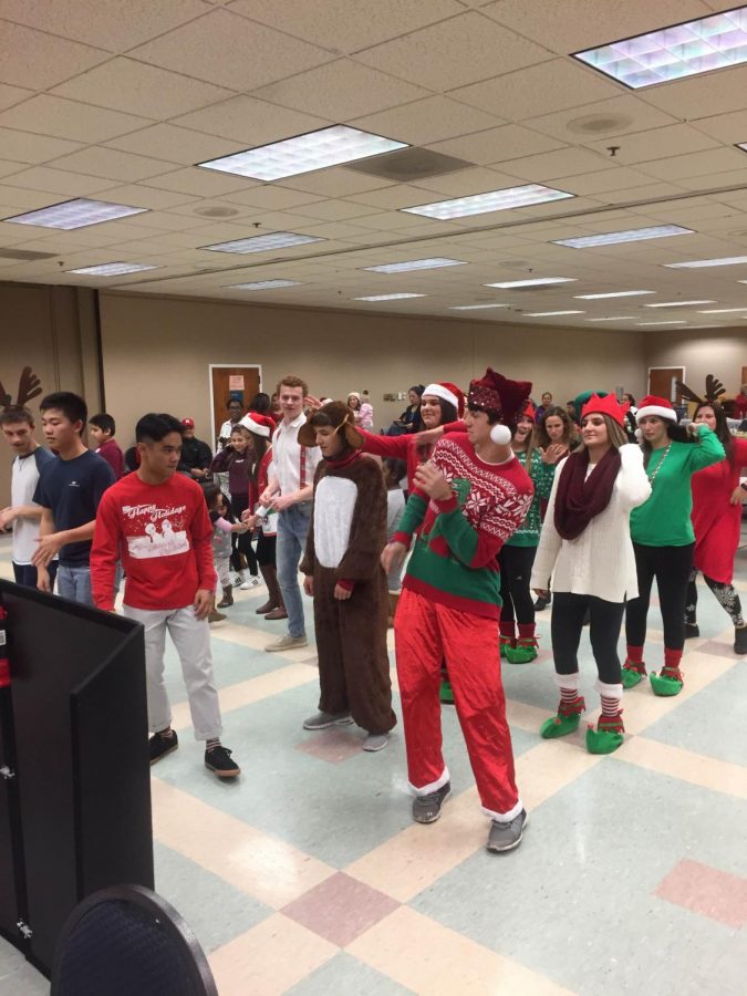 Members of Student Council dance along with the party attendees. 