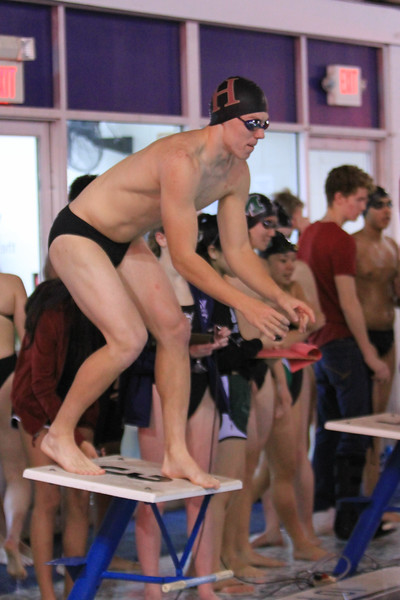 Junior Thomas Zdroik prepares to dive into the race against Montgomery.