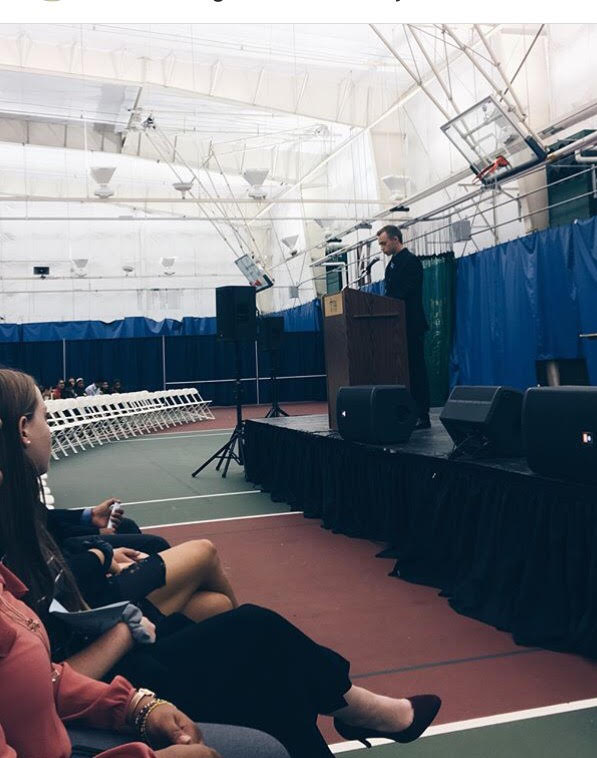 Former NJASC President, Cole Mitchell stands at the podium before he addresses the conference.