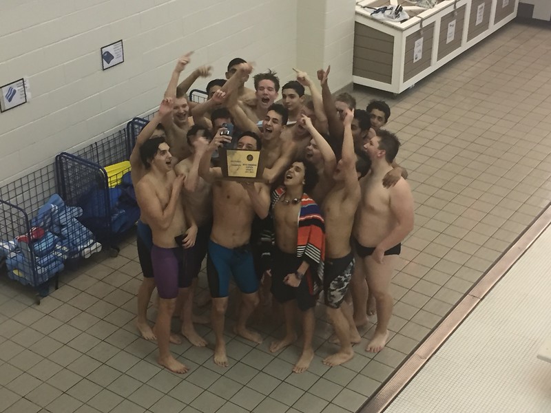 The team raises their trophy in jubilation. For Boro boys swim, the sectional title is their second in the last three seasons.