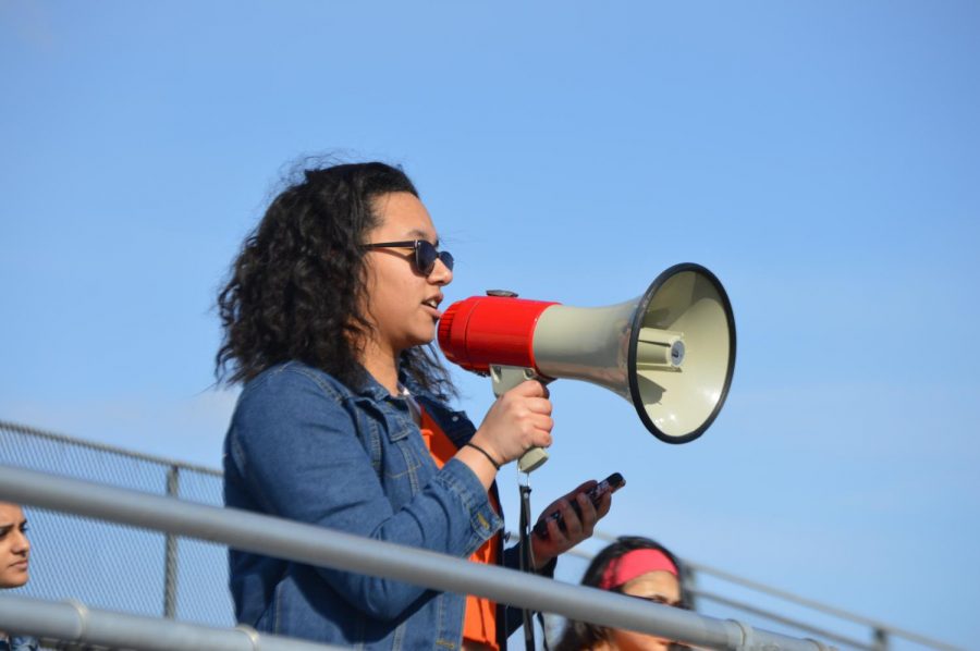 Sophomore Gabi Diaz recites a poem to the crowd.