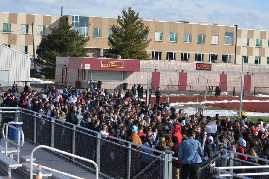 Over 1000 students make their way to the turf for the walkout. 