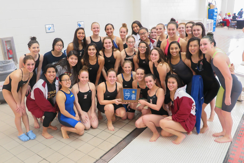 Girls swim is all smiles after capturing a third straight sectional title.