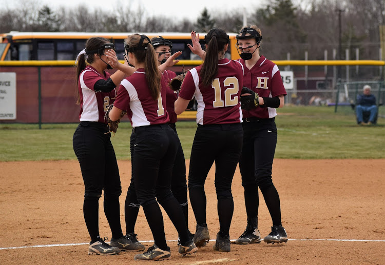 Last year's team huddles during the middle of the game discussing strategies. 