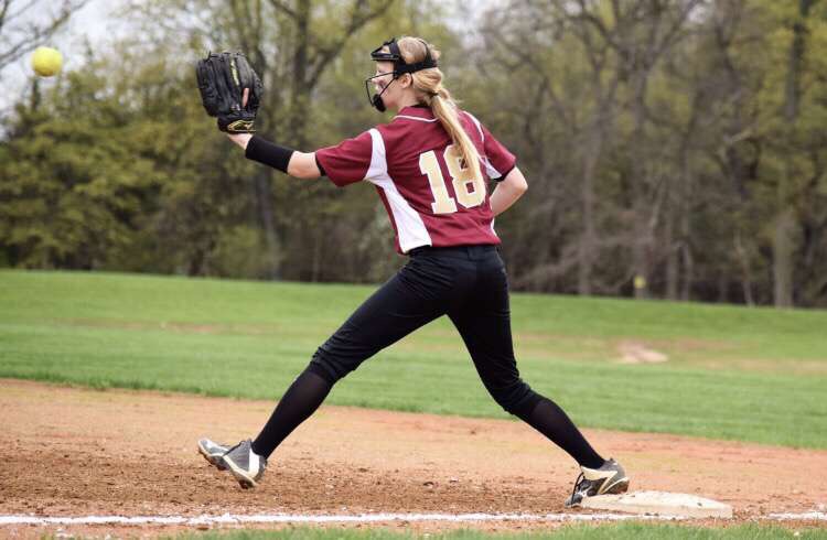 Sophomore Emily Orr reaches out to make a catch at first to record the out against East Brunswick.