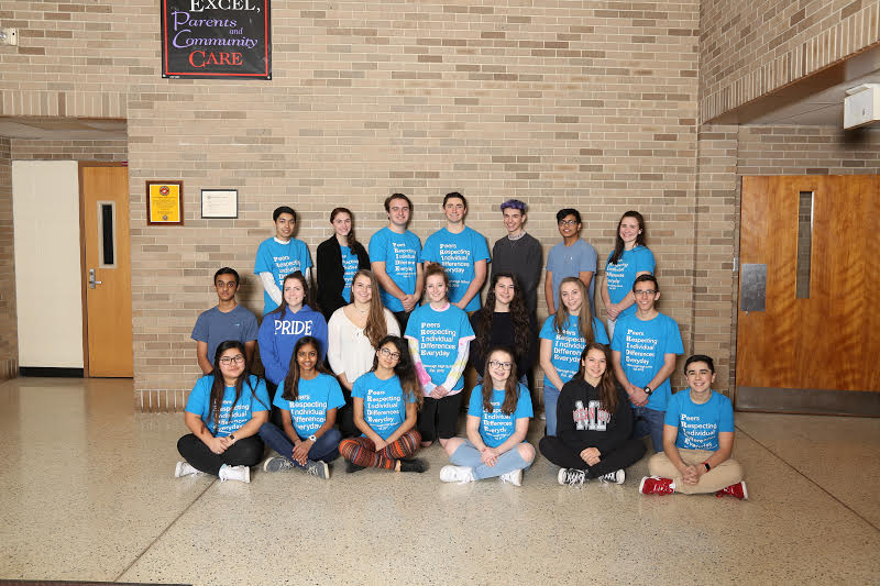 Members of PRIDE pose before journeying to Auten Road to speak to young Raiders.