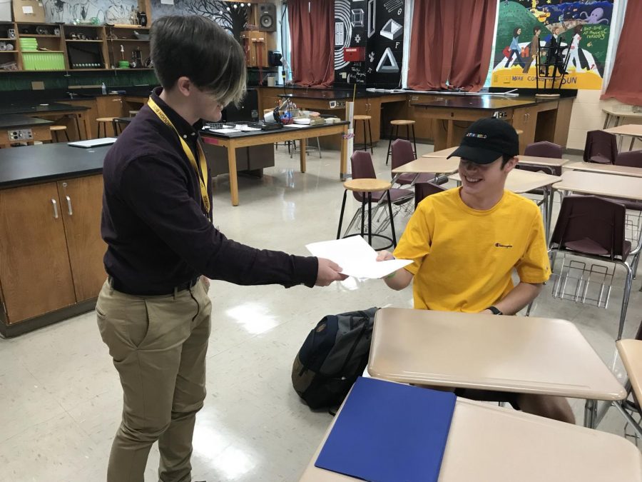 Student teacher Bryan Miner helping senior Ryan Wilke with his engineering project.