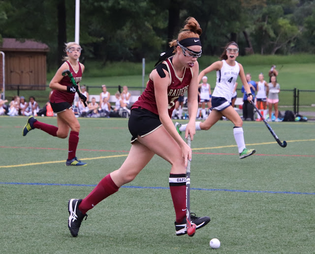 Senior Amanda Donnelly moves the ball into enemy territory.