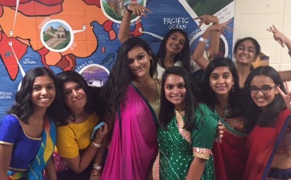 Garba goers pose for a picture.