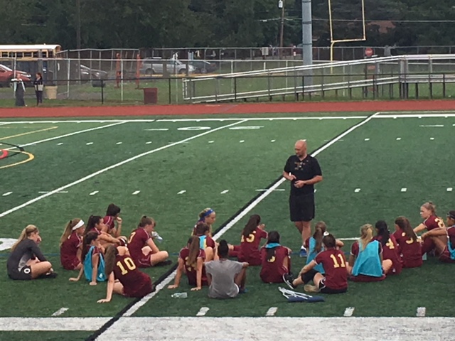 Head coach Lennart Bitter instructs the girls during half time of a recent contest.