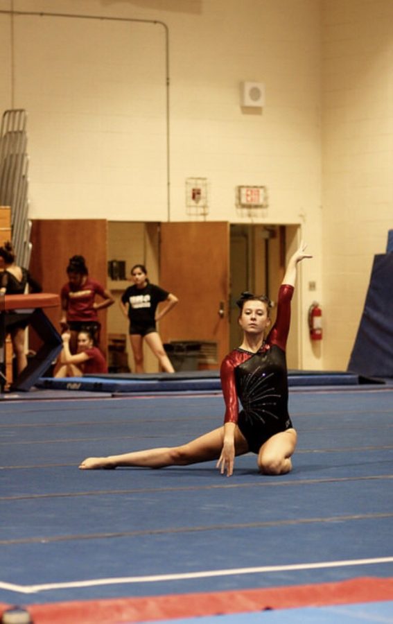 Senior Clare Hanlon preforms her floor routine.  