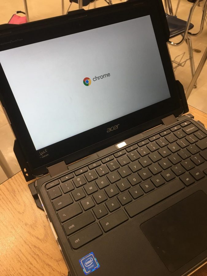 A Chromebook restarts after having its lid closed, much to students' frustration.