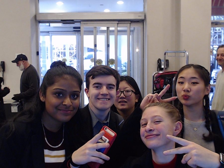 The victorious debaters, from left to right, Lasya Cheruvu, Dyrlan Warner, Teresa Buzzoni and Janice Lee pose for a picture at the competition held at NYU.