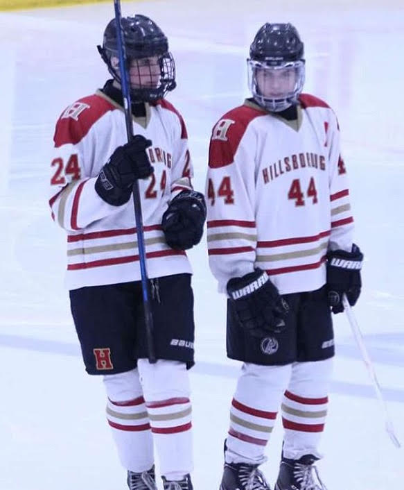 Captains Mike Jandoli (left) and Matt Palmer (right) stand on the ice during a recent contest.