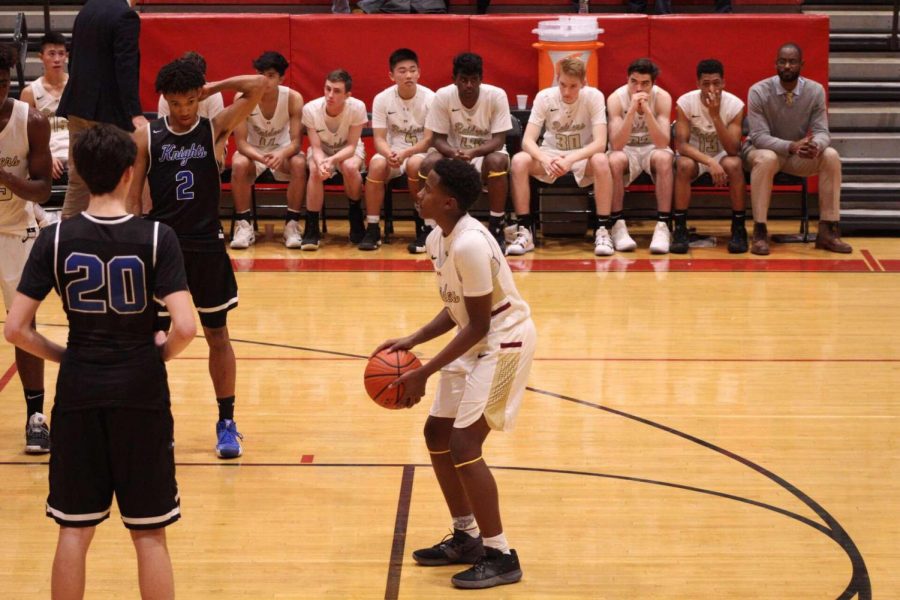 Allen Holmon lining up to shoot free throws after being fouled.