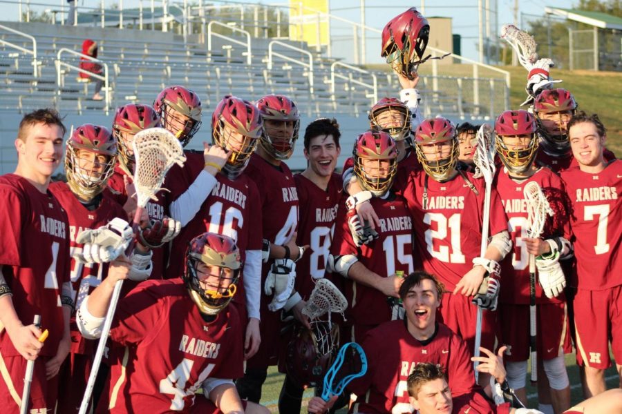 The Hillsborough lacrosse team poses for a photo after earning the first victory of the new season.