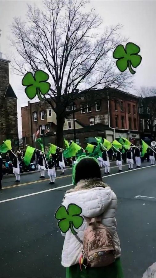 A spectator enjoys the Somerville St. Patrick's Day Parade over the weekend.