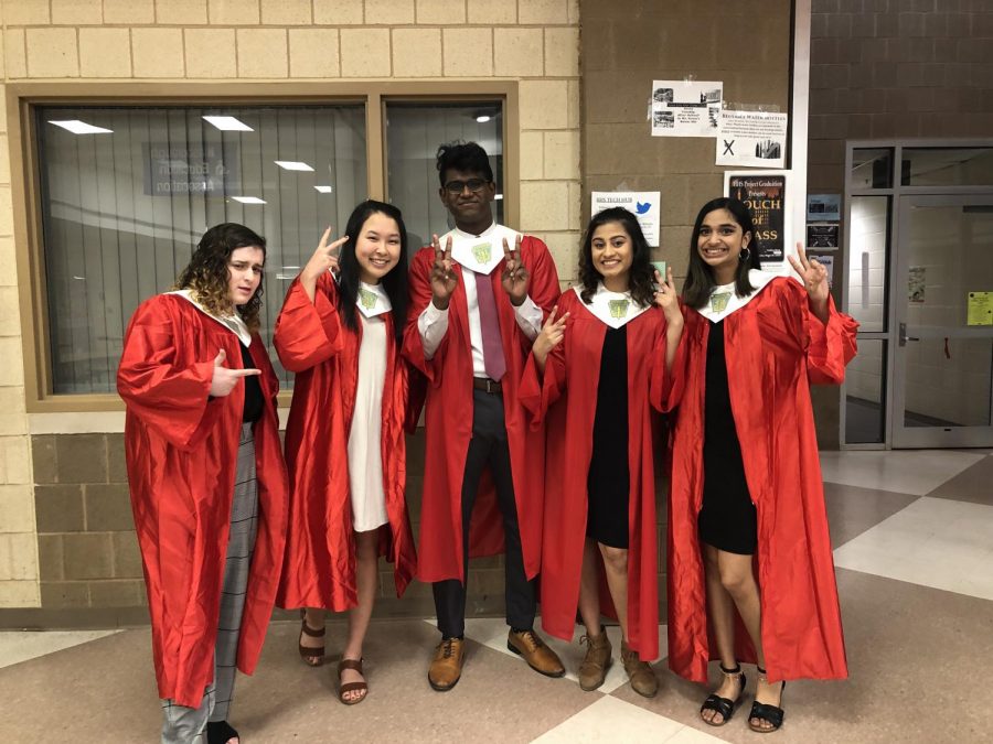 The executive board poses for a humorous picture before the ceremony. From left to right, seniors Lindsey Baum, Hanna Kim, Rupak Stephen, Meghan Patel and Mahitha Vivek.