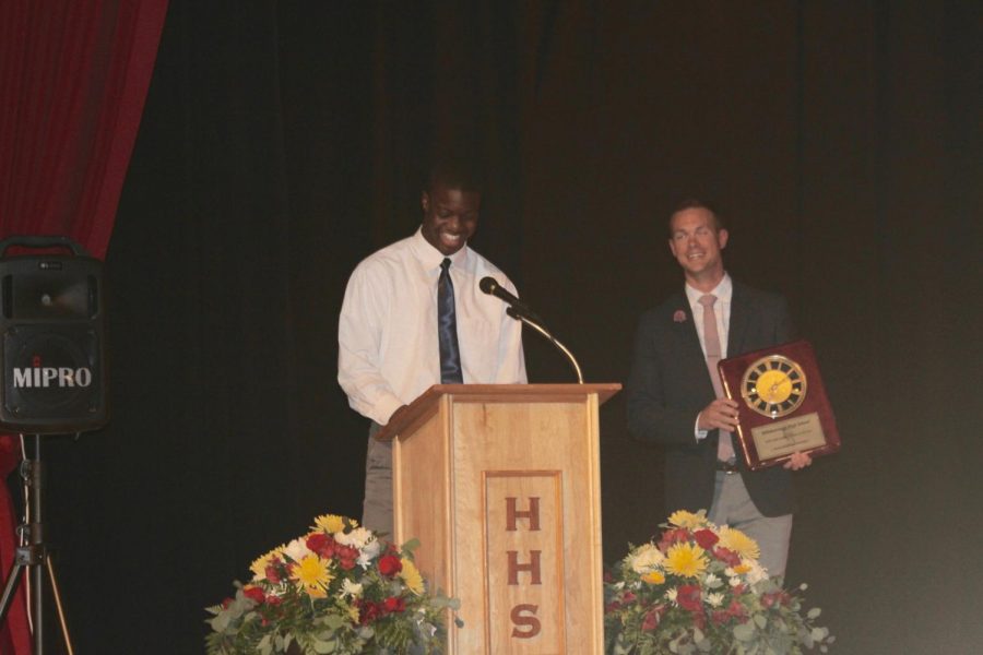 Dominique giving his speech for the Male Athlete of the Year award while Davis stands beside him, presenting Dominique's plaque.