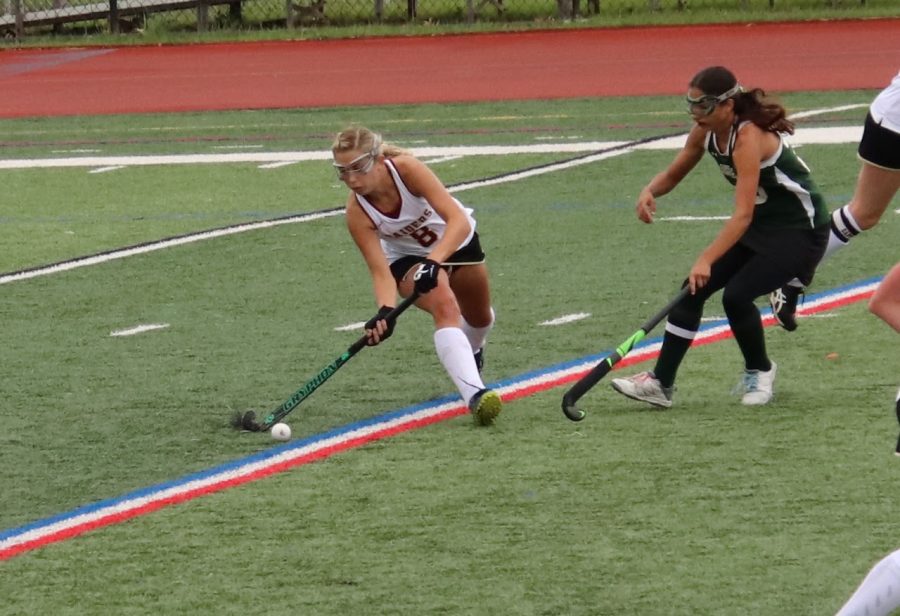 Senior Payton Altman battles for the ball against her opponent. 