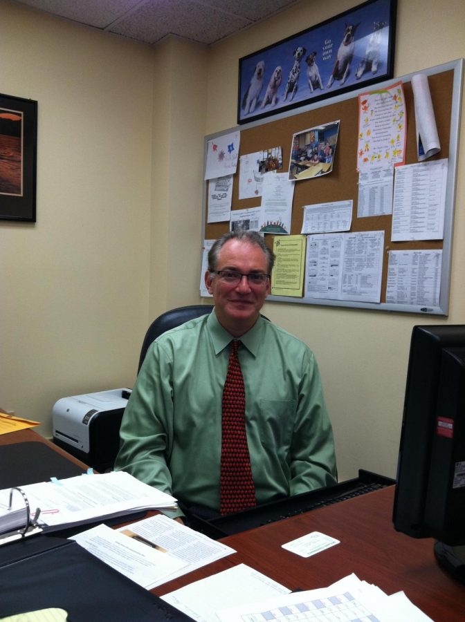 Dr. Schiff doing work at his desk where he's been leading the district since 2011.